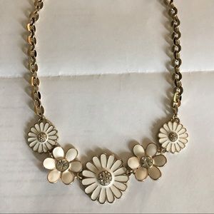 Gold and white enamel flower statement necklace.